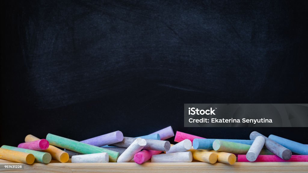 School or college blackboard background with colourful chalk School or college blackboard background with colourful chalk, toned Chalkboard - Visual Aid Stock Photo