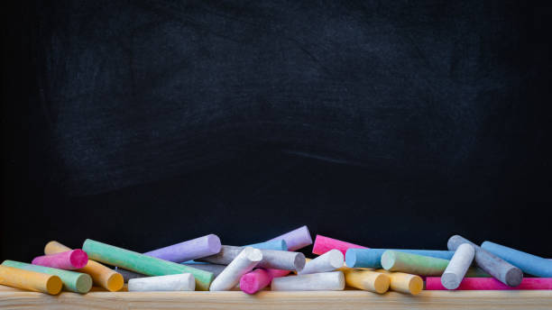 School or college blackboard background with colourful chalk School or college blackboard background with colourful chalk, toned school board stock pictures, royalty-free photos & images