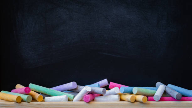 School or college blackboard background with colourful chalk School or college blackboard background with colourful chalk, toned writing on chalk board stock pictures, royalty-free photos & images
