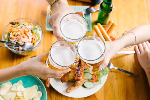 Beer glass on table with foods for celebrate party.Celebration Friendship Summer Fun Dinner Concept