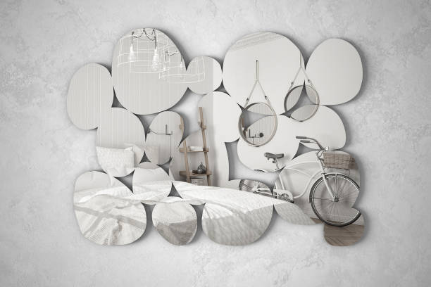 Modern mirror in the shape of pebbles hanging on the wall reflecting interior design scene, bright bedroom with bicycle, minimalist white architecture