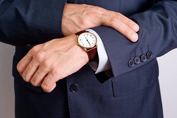 istock A businessman looking at his watch 95146187