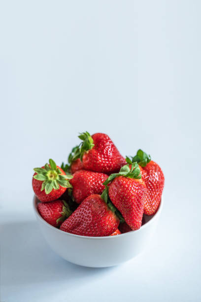 istock Juicy strawberries isolated on white background 951465916