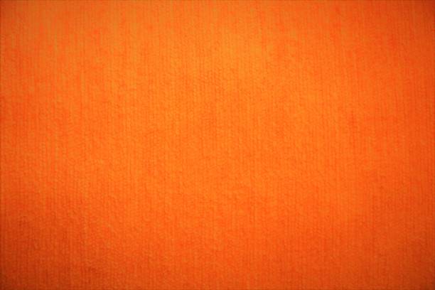 istock Orange textile fabric fluffy background in bright colors 951467414