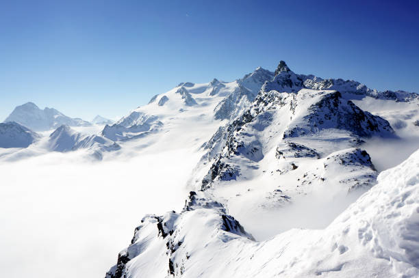 istock French Alpes above the clouds 951470294