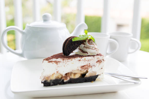 istock Chocolate cake with tea set in garden 951474850