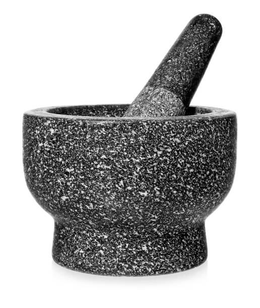 istock Granite mortar with pestle. Empty crushing dish, isolated on a white background. 951477916