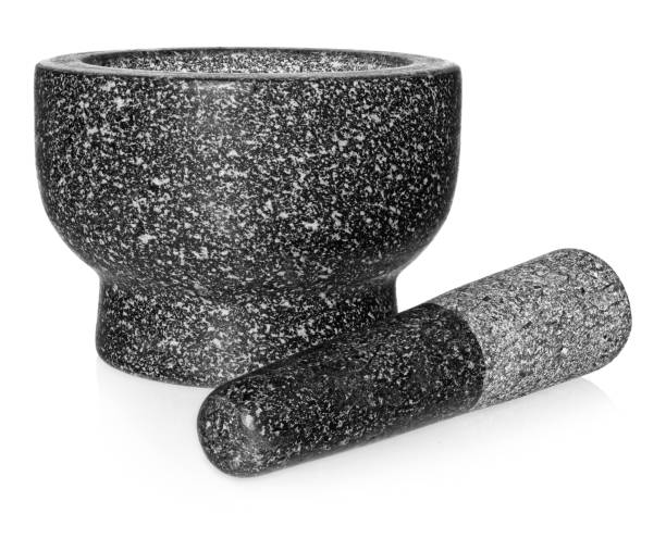 istock Granite mortar with pestle. Empty crushing dish, isolated on a white background. 951477926