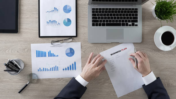 istock Confident businessman writing business plan, new ideas and strategy, motivation 951480986