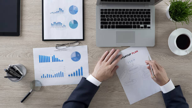 istock Businessman drawing components of startup plan, brainstorm and ideas, top view 951481116