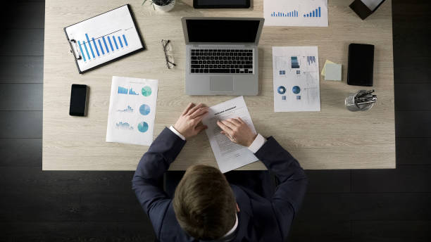 istock Serious businessman reading and signing purchase agreement, public procurement 951481120