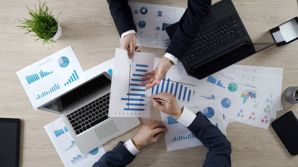istock Business partners actively discussing project results, sharing ideas at meeting 951481442