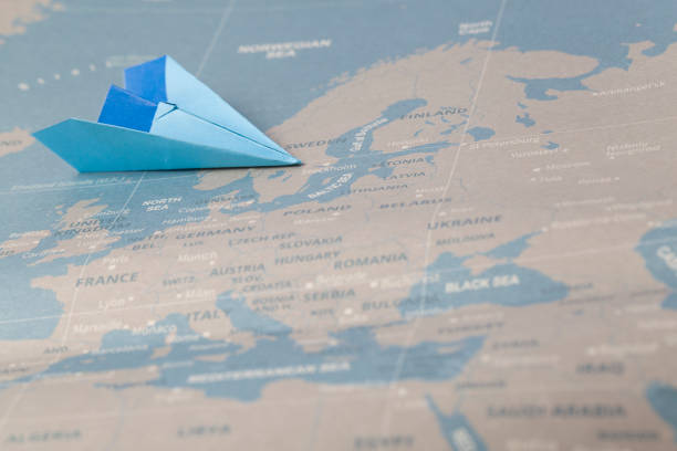 istock Hand crafted paper boat on worldmap background 951483504