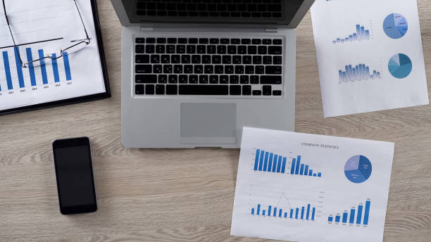 istock Lot of graphs for analyzing lying on desk in businessman's office, top view 951483518