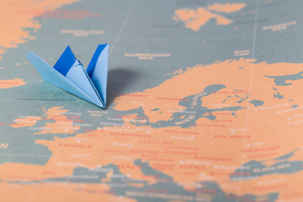 istock Hand crafted paper boat on worldmap background 951483552