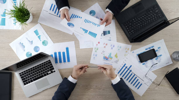 istock Managers checking business diagrams, discussing financial report, brainstorming 951483584