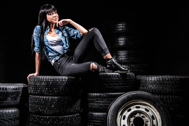 istock Woman sitting on a tires 951484618
