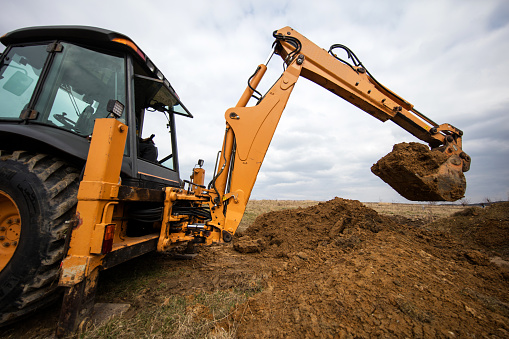 Performing construction works by a digger