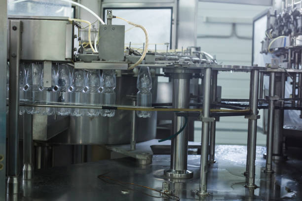 istock Water factory - Water bottling line for processing and bottling pure spring water into small bottles 951488822