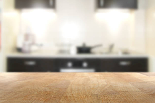 istock Wooden top table with blurred kitchen interior background 951489960