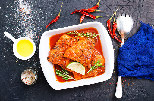 fish with tomato sauce and aroma spices, stock photo