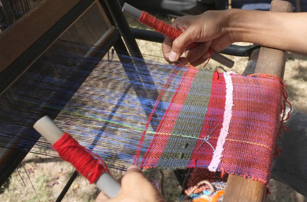istock The man weaving traditional thai fabric, 951499840