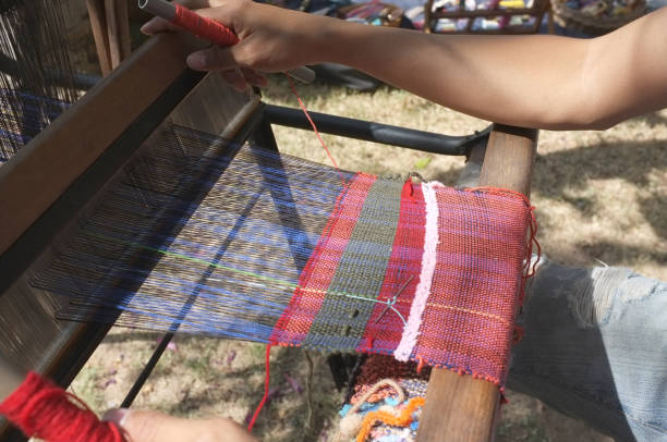 istock The man weaving traditional thai fabric, 951499922