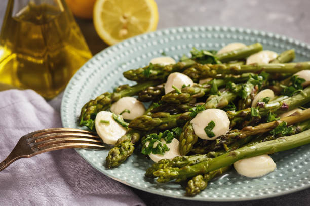 istock Asparagus with mozzarella cheese and lemon dressing. 951508552