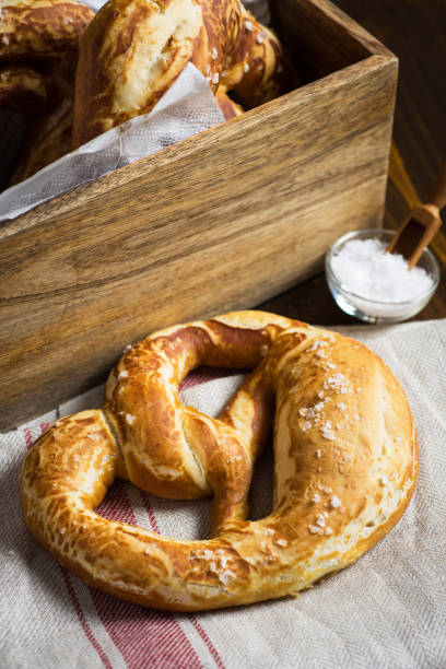 istock Pretzel with Sea Salt on Rustic Wooden Background 951509650
