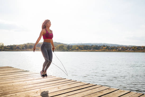 istock Fit young woman skipping a rope 951509678