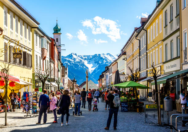 old town murnau murnau, germany - april 4: some people visiting the famous old town called untermarkt on april 4, 2018 in murnau, Germany lake staffelsee photos stock pictures, royalty-free photos & images