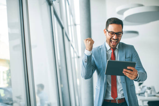 istock Young businessman with digital tablet in office 951526148
