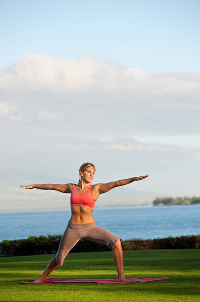 Female Yoga Student in Workout Routine stock photo