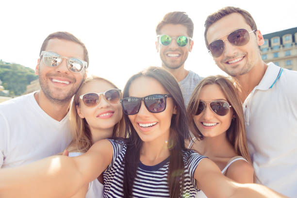 joyful happy boyfriends and girlfriends make selfie photo and looking at camera on weekend joyful boyfriends and girlfriends make selfie photo and looking at camera on weekend group of people wearing eyeglasses stock pictures, royalty-free photos & images
