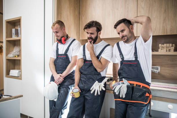 istock Team of disappointed manual workers at construction site. 951577096