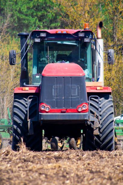 istock Farmer in tractor preparing land with seedbed cultivator 951616870
