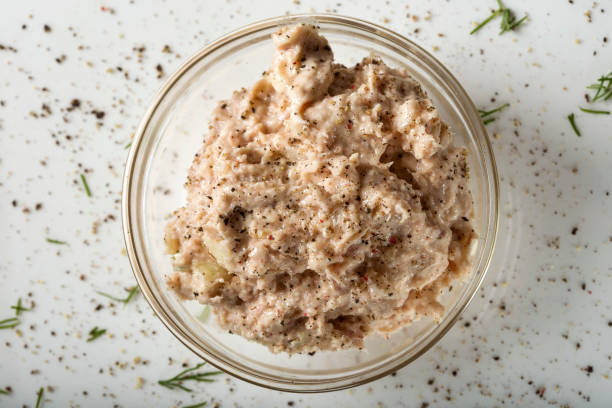 Homemade paste made from tuna fish, butter, onion and ground black pepper Homemade paste made from tuna fish, butter, onion and ground black pepper - top view tuna pate stock pictures, royalty-free photos & images