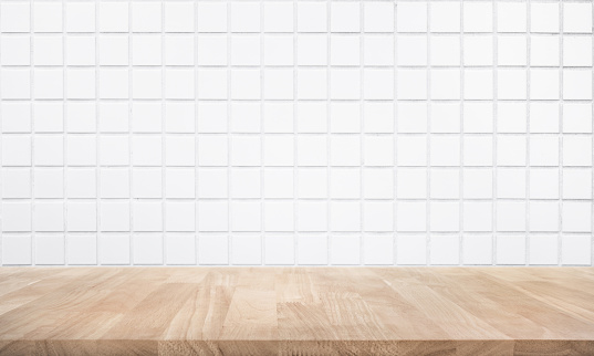 Empty wood table top with brick wall