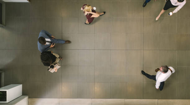 istock Businesspeople walking through a office hallway 951642698