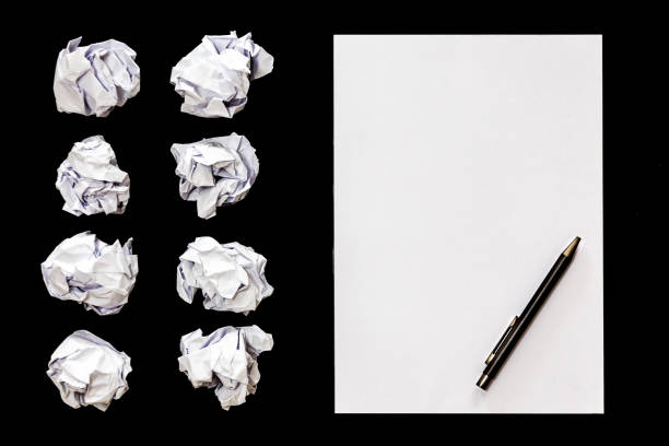 top view of office desk with blank paper notebook stock photo