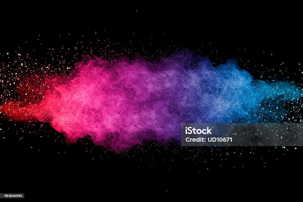 multicolored dust Explosion of multicolored dust on black background. Exploding Stock Photo