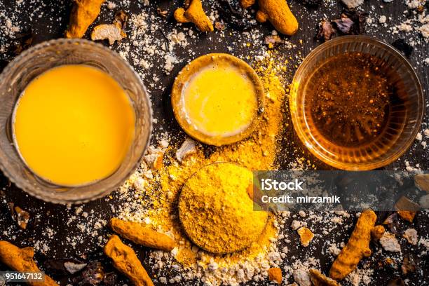 Close Up Of Ingredients Of Ayurvedic Treatment Or An Ayurvedic Face Pack Ie Honeychickpea Flour And Pasteturmeric Powder And Rose Petals On A Wooden Surfacethis Face Pack Removes Dead Skin Stock Photo - Download Image Now