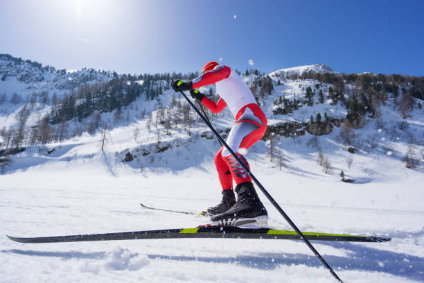 side view cross country skier skating on track