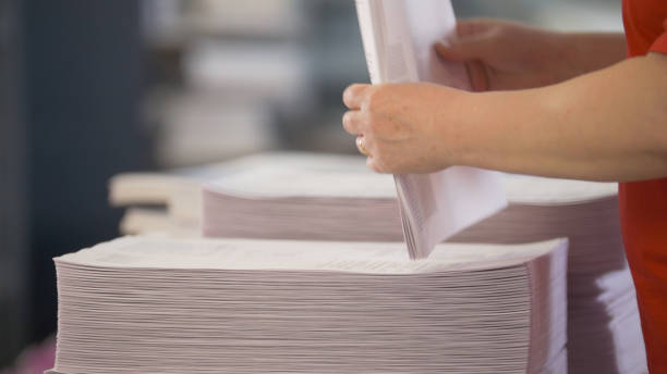 istock Hands of female workers shift the paper stacks 951648092