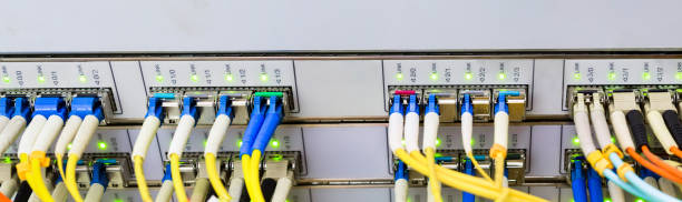istock Panorama of optical links are on the central data center router.The front panel of the master router. 951648542
