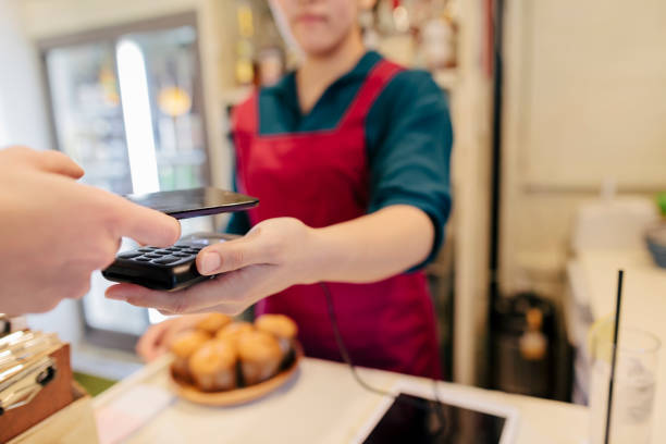 istock Woman Making Contactless Payment In Cafe 951650310