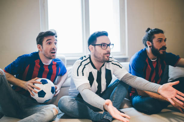 istock Male football supporters watching a game nervously 951652380