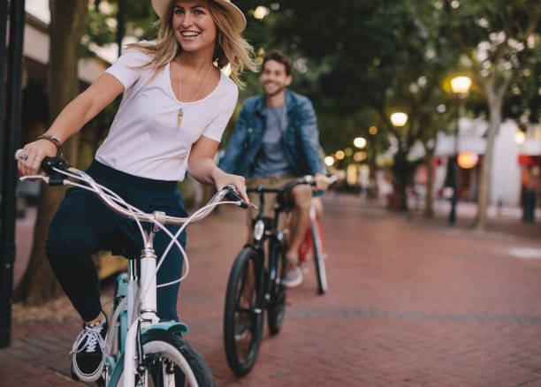 istock Woman enjoying cycling outdoors with friends 951652396