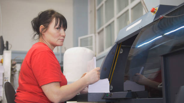 istock Female worker working with the printing press 951652788