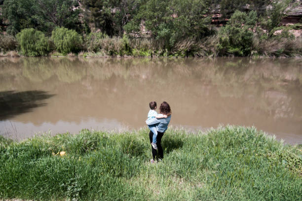 istock Mother and son on the riverbank 951654620